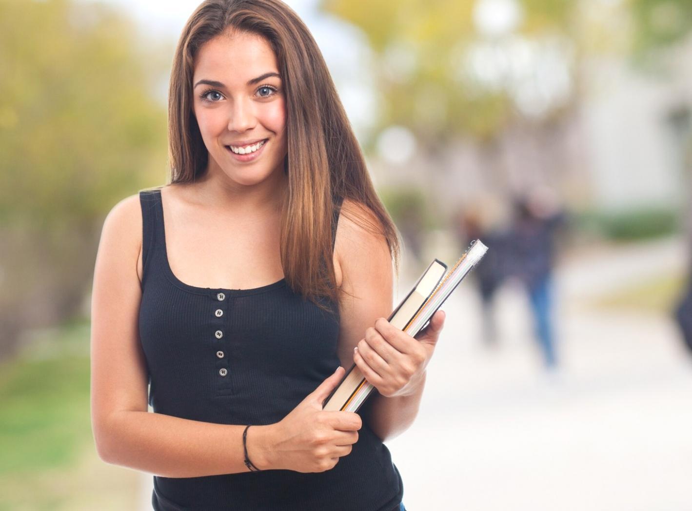 Trading desk workspace with multiple monitors showing stock market charts and financial data